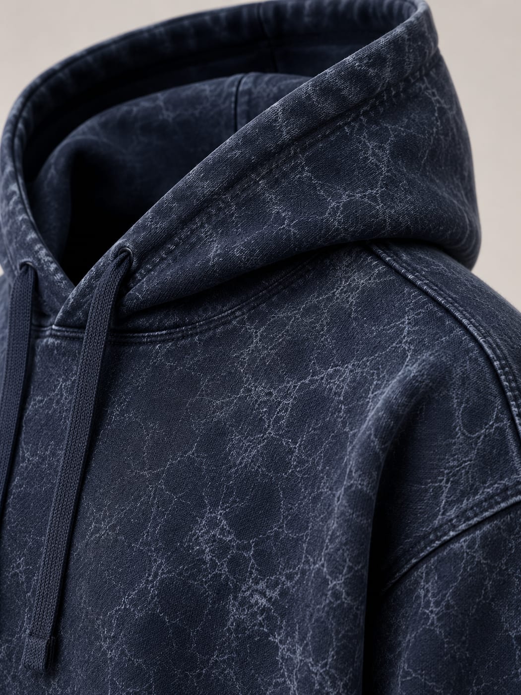 Close-up of the double-layer hood and drawcord on a navy 450 GSM acid wash hoodie