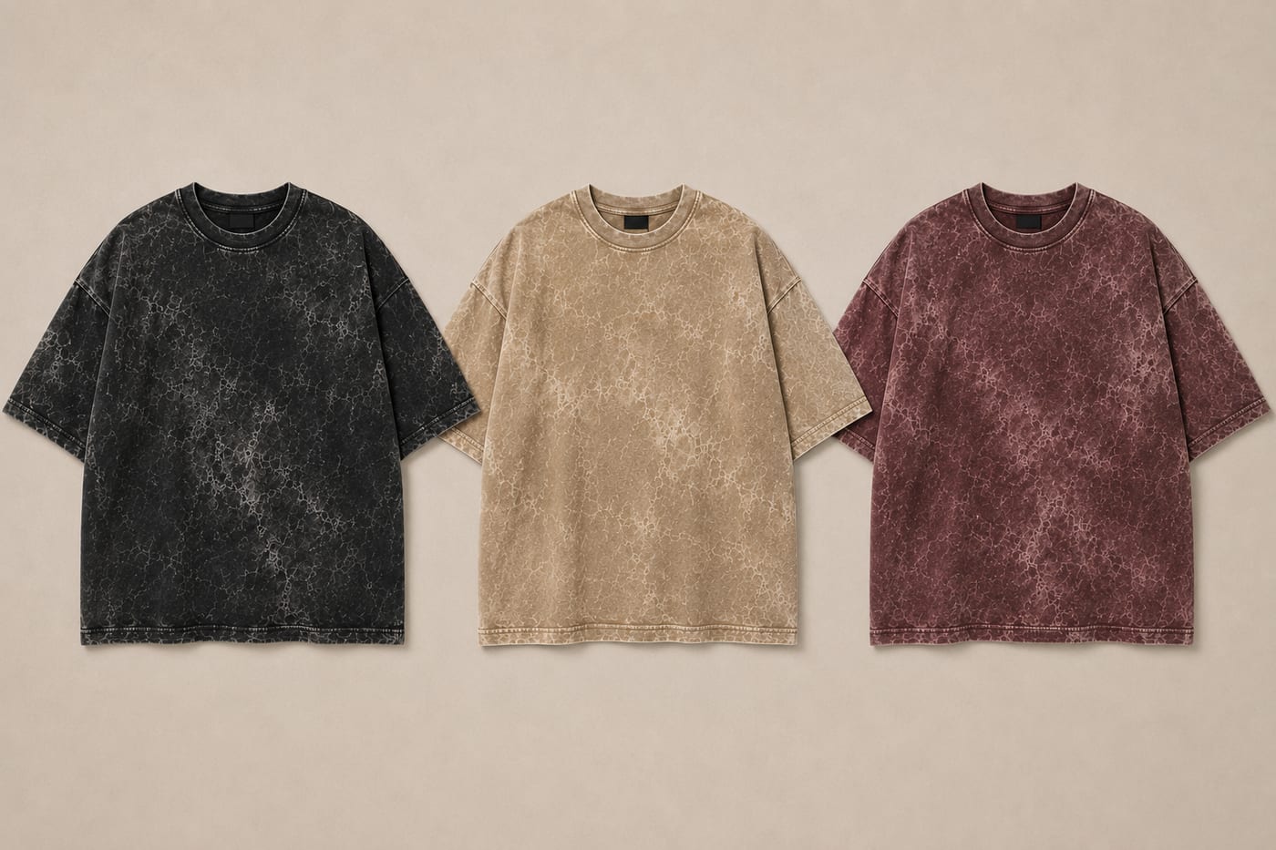 Three 300 GSM acid wash heavyweight tees side by side in black, sand and burgundy colourways
