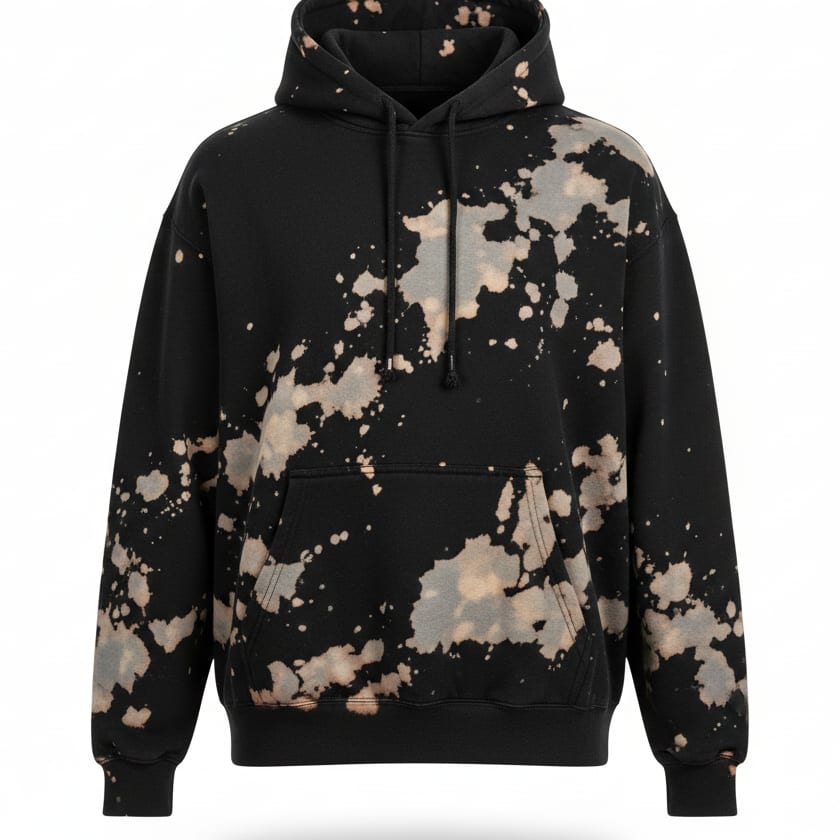 Black hoodie with a bleach-splatter wash finish