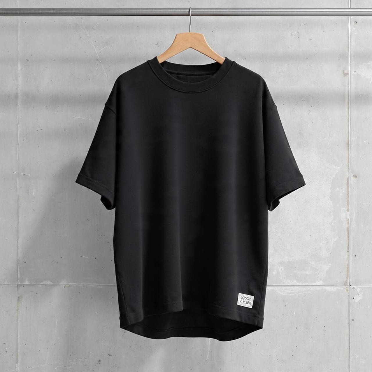 Black drop-shoulder t-shirt with woven hem label