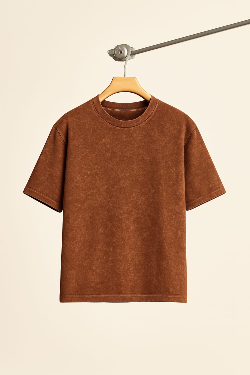 Acid-wash brown t-shirt on hanger