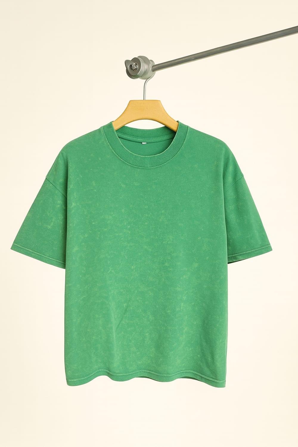 Stone-wash green t-shirt on hanger